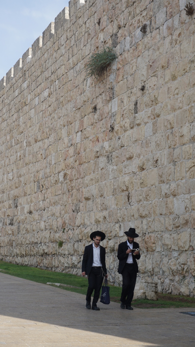 Orthodox Jews walking down the streets of Jerusalem